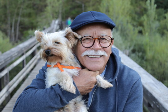 Tender senior man and his small dog