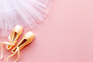 White ballet tutu skirt and beige pointe shoes with ribbon - obrazy, fototapety, plakaty