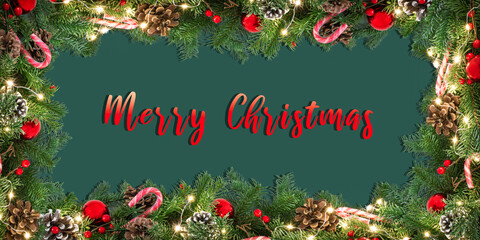 Christmas decorated and illuminated garland frame on green background with red written text Merry...