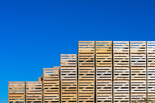 stack of pallets in front of blue sky