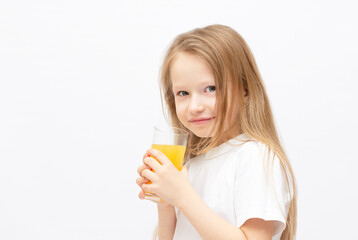Cute little girl with the orange juice