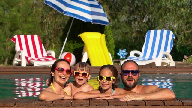 Happy family having fun on summer vacation. Slow motion
