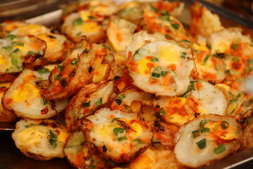 Authentic local vietnamese street food, grilled quail eggs or Trung Cut Nuong which is a delicacy in Can tho, Vietnam