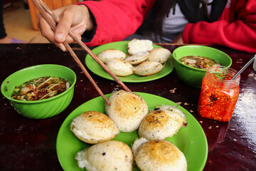 Banh Can Nha Chung or fried quail eggs with meat ball soup that is a famous local delicacy in Da...