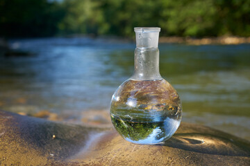 Flask with clear river water.