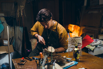 man working with wood in his workshop