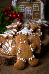 Christmas homemade gingerbread cookies, gingerbread man on wooden table