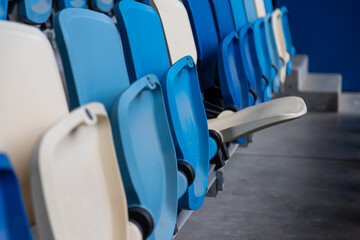 empty colorful seats on tribunes of stadium