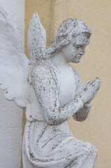 Vintage image of a sad angel on a bright background. detail