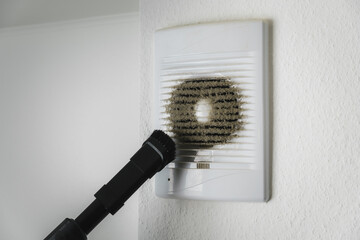 Very dirty and dusty white plastic ventilation grill. Ventilation shaft in the apartment. dirty air...