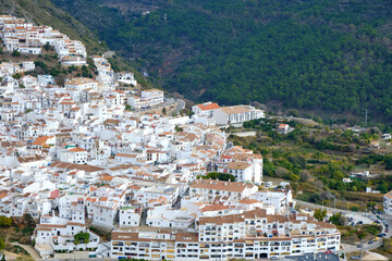 Naklejka premium Ojén Spain urban view of the city with beautiful green nature around on a cloudy day, small Spanish old town