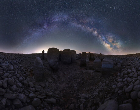 Megalithic landmark under stars sky with Milky Way arch