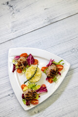 minced veal steaks with mashed potatoes and salad