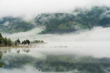 Foggy lanscape at Vågåvatnet, Oppland, Norway