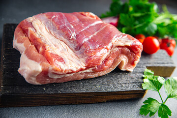 Belly pork meat fresh piece of bacon meat layer of lard fat Sponder healthy meal food diet snack on the table copy space food background rustic. top view