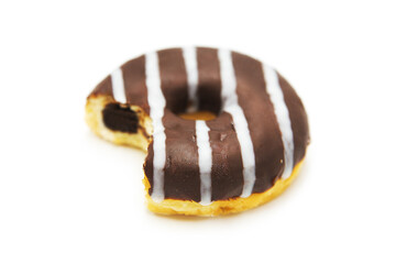 Bitten donut with frosting and filling isolated on white background.	
