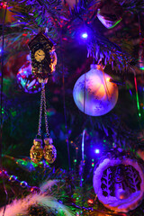 Old vintage glass toys and lights on Christmas tree. Merry xmas and Happy New Year decoration....