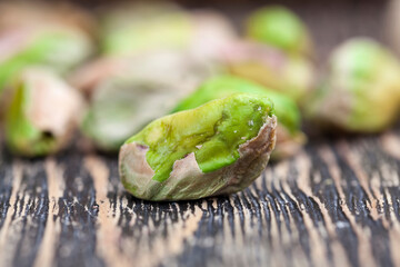 fried salted pistachio nuts , close up