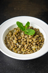 green lentils stewed bean sauce healthy meal food diet snack on the table copy space food background rustic