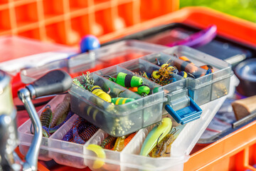 A large fisherman's tackle box fully stocked with lures and gear for fishing.fishing lures and...