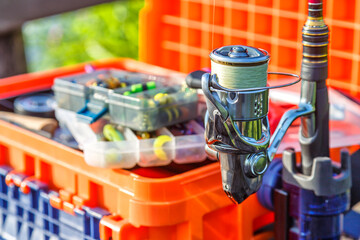 A large fisherman's tackle box fully stocked with lures and gear for fishing.fishing lures and...