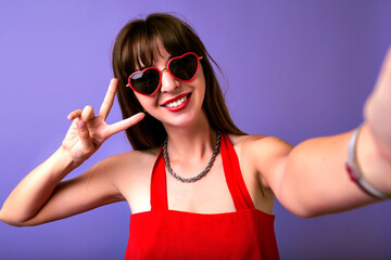 Studio lifestyle portrait of pretty brunette trendy woman wearing summer elegant red dress,