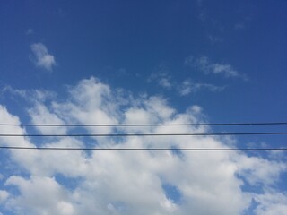 Fototapeta premium lines againt blue sky and white clouds