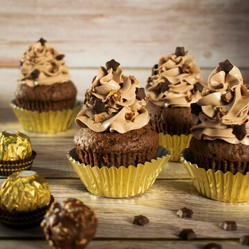 Ferrero Rocher Christmas Chocolate Cupcakes. Muffins With Chocolate Cream.