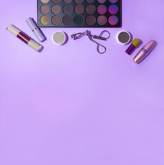 Decorative cosmetics, top view. Make-up with professional cosmetics, on a lilac background, the color of the year 2022. A flat image with space to copy. High quality photo