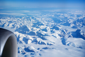 GREENLAND - 10 MAY 2018: View from the aircraft window of the engine of a Boeing 787 over the...