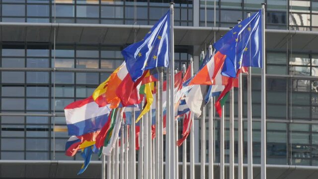 December 7, 2021 - Strasbourg, France: European Parliament Building. Flags of European countries waving with European Parliament headquarter building in background includes United Kingdom