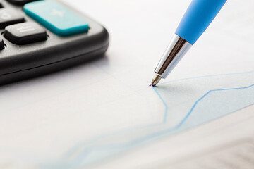 Accounting document with pen,color diagram and checking financial chart. Concept of banking,...