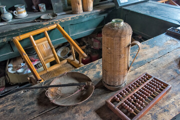 Abacus, scale and thermos bottle on the counter in an old tea house, Chengdu, Sichuan Province, China