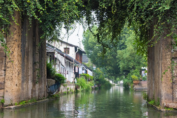 Obraz premium Stone bridge and traditional houses on the Grand Canal, Shaoxing, Zhejiang Province, China