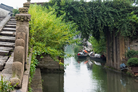 Wupeng boat and stone bridge on the Grand Canal, Shaoxing, Zhejiang Province, China