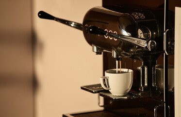 Coffee time. Making a cup of cappuccino at an espresso professional machine. One of the most favorite drinks in the world. Coffee speciality.