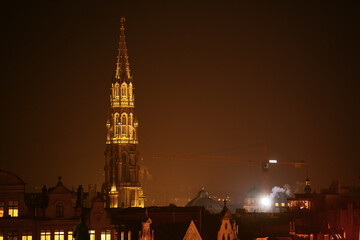Fototapeta na wymiar Brussels by night during a foggy winter evening. View to Grand Place amazing landmark in Belgium.