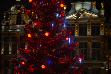 Winter holidays. The amazing Christmas tree in red color decorations from Grand Place in Bruxelles, Belgium.