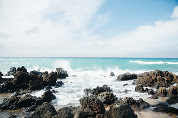 Beautiful shot of oceanfront with rocks and waves in Maui