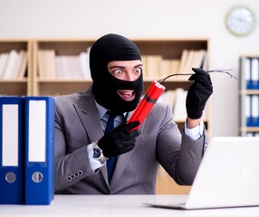 Criminal businessman with dynamite in the office