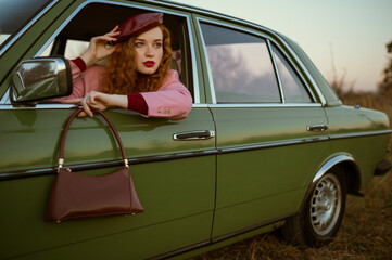 Fashionable woman wearing trendy faux leather beret, holding stylish brown bag, handbag, posing in...