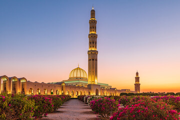 Middle East, Arabian Peninsula, Oman, Muscat. Sunset view of the Sultan Qaboos Grand Mosque in...