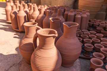 Fototapeta na wymiar Middle East, Arabian Peninsula, Oman, Ad Dakhiliyah, Bahla. Pots at the Al-Adawi pottery factory in Oman. (Editorial Use Only)