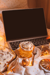 Christmas flatlay with cinnamon rolls and candles