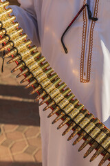 Obraz premium Middle East, Arabian Peninsula, Oman, Ad Dakhiliyah, Nizwa. A belt of rifle ammunition at the Nizwa souk.