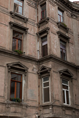Fototapeta na wymiar Old historic brown buliding. Lots of window.