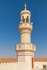 Fototapeta na wymiar Middle East, Arabian Peninsula, Ash Sharqiyah North, Bidiyah. The minaret of a mosque in the desert of Oman.