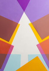 The shape of a Christmas tree made of colorful decorative paper