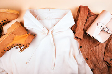Fall fashion flatlay with hoodie and brown corduroy shirt