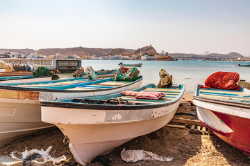 Middle East, Arabian Peninsula, Al Batinah South. Fishing boats on the beach in the harbor of Sur, Oman.